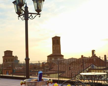 Enjoy a drink on the rooftop terrace of the Hotel San Donato overlooking Bologna