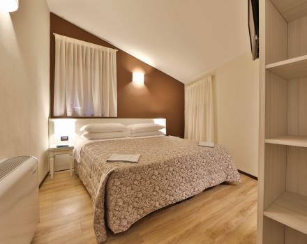 Modernas y amplias habitaciones familiares para 4 personas en el Hotel San Donato